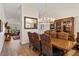 Elegant dining room featuring a wooden table, upholstered chairs, and a decorative chandelier at 2630 Moss Oak Dr # 50, Sarasota, FL 34231