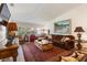 Comfortable living room with ample seating, decorative rug, and large windows providing natural light at 2630 Moss Oak Dr # 50, Sarasota, FL 34231