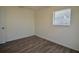Comfortable bedroom featuring laminate flooring, a window, and neutral paint at 321 40Th Street Nw Ct, Bradenton, FL 34209
