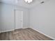 Comfortable bedroom with laminate flooring, a ceiling fan, and white trim at 321 40Th Street Nw Ct, Bradenton, FL 34209