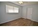 Bright bedroom featuring vinyl flooring, a window, and white trim at 321 40Th Street Nw Ct, Bradenton, FL 34209