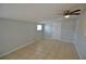 Cozy bedroom featuring tile flooring, a ceiling fan, and neutral paint at 321 40Th Street Nw Ct, Bradenton, FL 34209