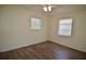 Bright bedroom features wood-look floors and a ceiling fan at 321 40Th Street Nw Ct, Bradenton, FL 34209