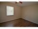 Plain bedroom offers wood-look floors and a window at 321 40Th Street Nw Ct, Bradenton, FL 34209