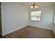 The dining room features modern chandelier and wood-look floors at 321 40Th Street Nw Ct, Bradenton, FL 34209