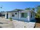 Charming single-story home featuring a fresh exterior paint, a covered entry, and minimal landscaping at 321 40Th Street Nw Ct, Bradenton, FL 34209