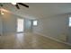 Inviting living room featuring tile flooring, a ceiling fan, and glass panel back door at 321 40Th Street Nw Ct, Bradenton, FL 34209