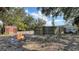 Enjoy the spacious backyard with a firepit and wooden fence at 3365 7Th St, Sarasota, FL 34237