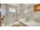 Practical bathroom featuring a vanity, toilet, and shower, designed for accessibility and convenience at 3365 7Th St, Sarasota, FL 34237