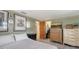 A well-lit bedroom featuring classic floral wallpaper trim and a glimpse into the closet for ample storage at 3365 7Th St, Sarasota, FL 34237