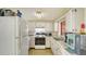Functional kitchen with white appliances, ample counter space, and classic tiled backsplash at 3365 7Th St, Sarasota, FL 34237