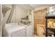 A functional laundry room with a washer and dryer, perfect for handling household chores at 3365 7Th St, Sarasota, FL 34237