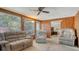 Inviting living area showcasing comfortable sofas, wood accents, and an open doorway to the bedroom at 3365 7Th St, Sarasota, FL 34237