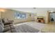 Spacious living area with a large window, comfortable seating, and a television on a wooden stand at 3365 7Th St, Sarasota, FL 34237