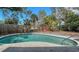 Refreshing in-ground pool with fence, enhancing privacy for tranquil relaxation and outdoor enjoyment at 3365 7Th St, Sarasota, FL 34237