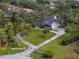Bird's-eye view of a stunning home surrounded by mature trees and manicured lawns at 3783 Beneva Oaks Blvd, Sarasota, FL 34238