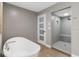 Contemporary bathroom with a freestanding tub and tiled walk-in shower at 3783 Beneva Oaks Blvd, Sarasota, FL 34238