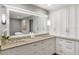 Bright bathroom featuring dual sinks, a large mirror, and ample storage space at 3783 Beneva Oaks Blvd, Sarasota, FL 34238