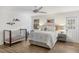 Well-lit bedroom with a crib and a cozy bed at 3783 Beneva Oaks Blvd, Sarasota, FL 34238