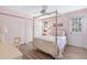 Cozy bedroom with a four-poster bed and ample closet space at 3783 Beneva Oaks Blvd, Sarasota, FL 34238