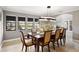 Bright dining room with large windows and views of the lush landscaping at 3783 Beneva Oaks Blvd, Sarasota, FL 34238