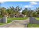 Stately two-story home boasts a brick facade, a sprawling lawn and mature landscaping at 3783 Beneva Oaks Blvd, Sarasota, FL 34238