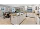 Spacious kitchen featuring an island, dining area, granite countertops, and stainless appliances at 3783 Beneva Oaks Blvd, Sarasota, FL 34238