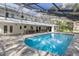 Beautiful screened pool area with outdoor dining and seating, perfect for entertaining and relaxation at 3783 Beneva Oaks Blvd, Sarasota, FL 34238