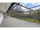Large screened porch with a view of the backyard at 3783 Beneva Oaks Blvd, Sarasota, FL 34238