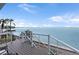 Enjoy serene water views from this coastal balcony with modern white railings and relaxing seating at 5279 Isla Key S Blvd # 113, St Petersburg, FL 33715