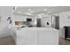 The well-equipped kitchen boasts quartz counters, stainless appliances, and modern white cabinets at 5279 Isla Key S Blvd # 113, St Petersburg, FL 33715