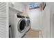 Modern laundry room featuring a side-by-side washer and dryer at 5279 Isla Key S Blvd # 113, St Petersburg, FL 33715