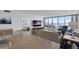 Open-concept living room and dining area with large windows providing stunning water views and natural light at 5279 Isla Key S Blvd # 113, St Petersburg, FL 33715
