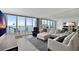 Bright living room features water views from the balcony, comfortable seating, and mirrored wall to enhance the space at 5279 Isla Key S Blvd # 113, St Petersburg, FL 33715
