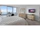 Beautiful primary bedroom with water views, neutral tones, tiled floors, and plenty of natural light at 5279 Isla Key S Blvd # 113, St Petersburg, FL 33715