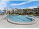 Large community pool surrounded by tropical landscaping and loungers at 5279 Isla Key S Blvd # 113, St Petersburg, FL 33715