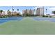 Enjoy a match on the well-maintained tennis courts with views of the surrounding buildings and beautiful blue sky at 5279 Isla Key S Blvd # 113, St Petersburg, FL 33715