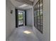 Covered entryway featuring neutral paint and tile flooring at 5974 San Michelle Dr, Sarasota, FL 34243