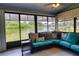 Enclosed lanai featuring view of backyard and lake at 5974 San Michelle Dr, Sarasota, FL 34243