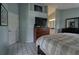 Bright main bedroom with a large bed and access to an ensuite bathroom at 5974 San Michelle Dr, Sarasota, FL 34243