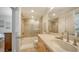Modern bathroom featuring a shower over tub combination and a well-lit vanity area at 6512 Midnight Pass Rd # 206, Sarasota, FL 34242