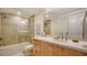 Bright bathroom with a shower over tub and a single sink vanity with ample counter space at 6512 Midnight Pass Rd # 206, Sarasota, FL 34242