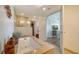 Elegant bathroom featuring a marble-topped tub, a separate shower, and access to the bedroom at 6512 Midnight Pass Rd # 206, Sarasota, FL 34242