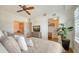 Comfortable bedroom features two beds, a TV on a dresser, and access to a closet and bathroom at 6512 Midnight Pass Rd # 206, Sarasota, FL 34242