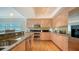 Well-equipped kitchen with stainless steel appliances, granite countertops, and ample storage space at 6512 Midnight Pass Rd # 206, Sarasota, FL 34242