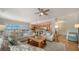Cozy living room featuring neutral decor, hardwood floors, and an open floorplan at 6512 Midnight Pass Rd # 206, Sarasota, FL 34242