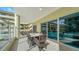 Spacious covered patio with ample seating, perfect for outdoor dining and entertaining at 6512 Midnight Pass Rd # 206, Sarasota, FL 34242