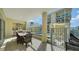 Inviting patio area with outdoor kitchen, dining space, and pool view at 6512 Midnight Pass Rd # 206, Sarasota, FL 34242