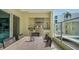 Outdoor patio featuring built in grill and outdoor kitchen, and a large dining table at 6512 Midnight Pass Rd # 206, Sarasota, FL 34242