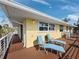 Spacious balcony featuring two blue lounge chairs, perfect for relaxation and outdoor enjoyment at 691 Linley St, Longboat Key, FL 34228